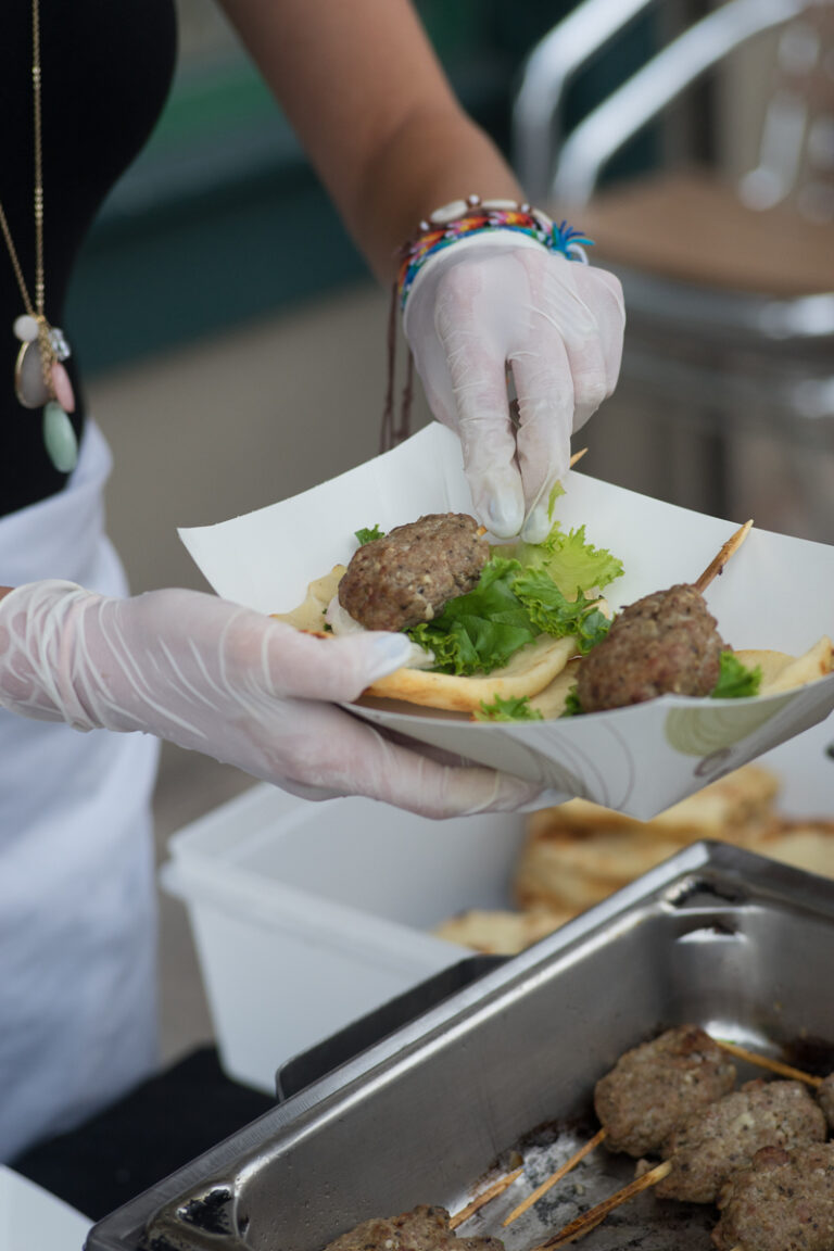 Close up of hands serving food