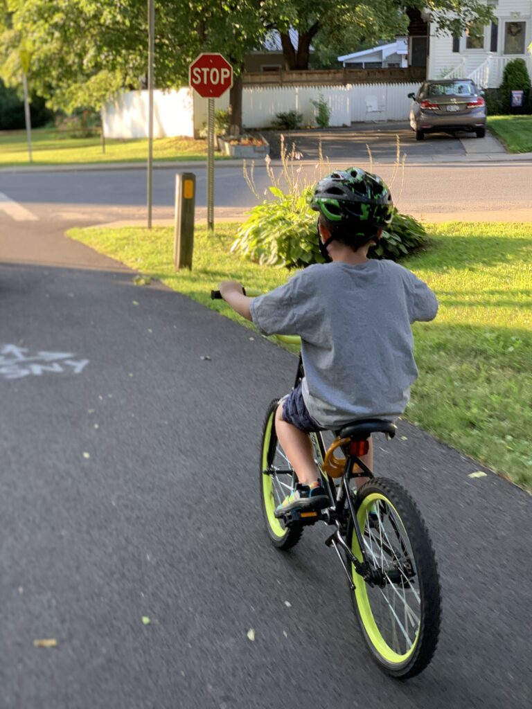 Boy with helmet on bicycle