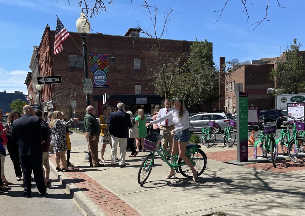 Girl trying out bike in Downtown Glens Falls