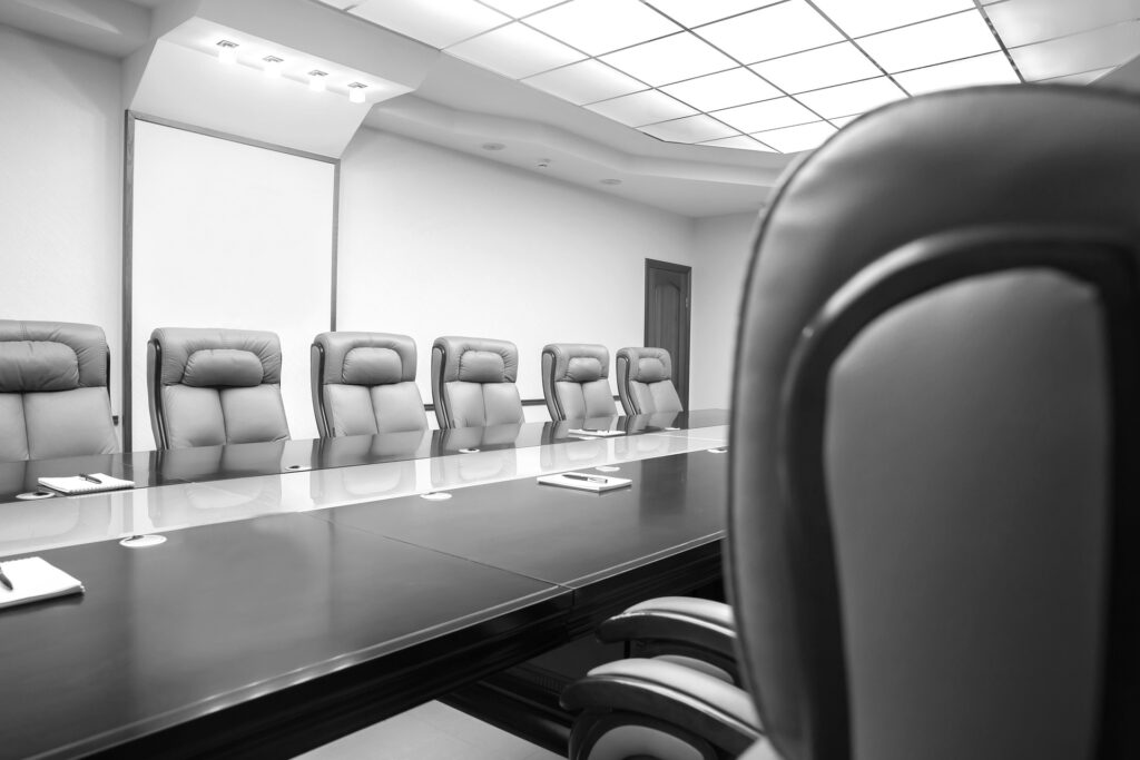 Black and white image of an empty meeting room