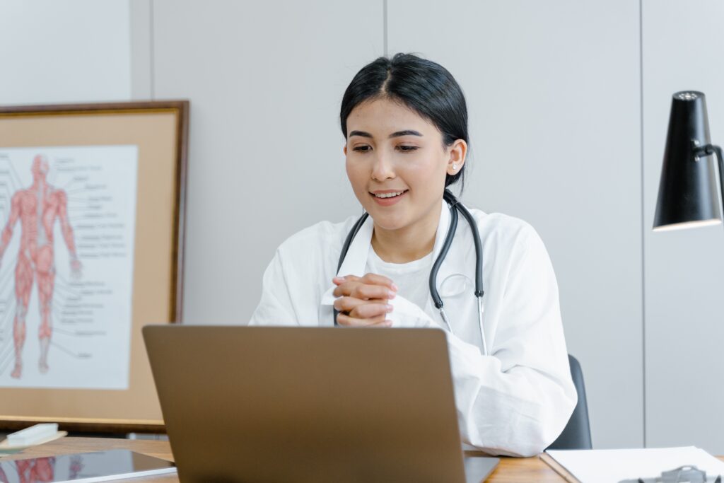 Doctor looking at her computer