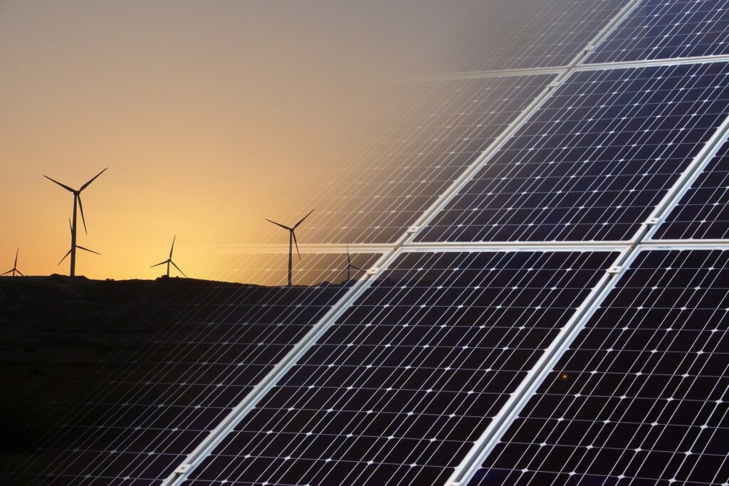 Photo of solar panel and wind farm